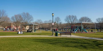 Community enjoying a vibrant urban park with modern recreational facilities funded by federal initiatives.
