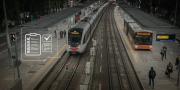 Modern public transit system with train and bus, symbolizing new federal guidelines implementation.